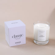 Amaraa classic soy wax candle in glass jar with box on neutral background
